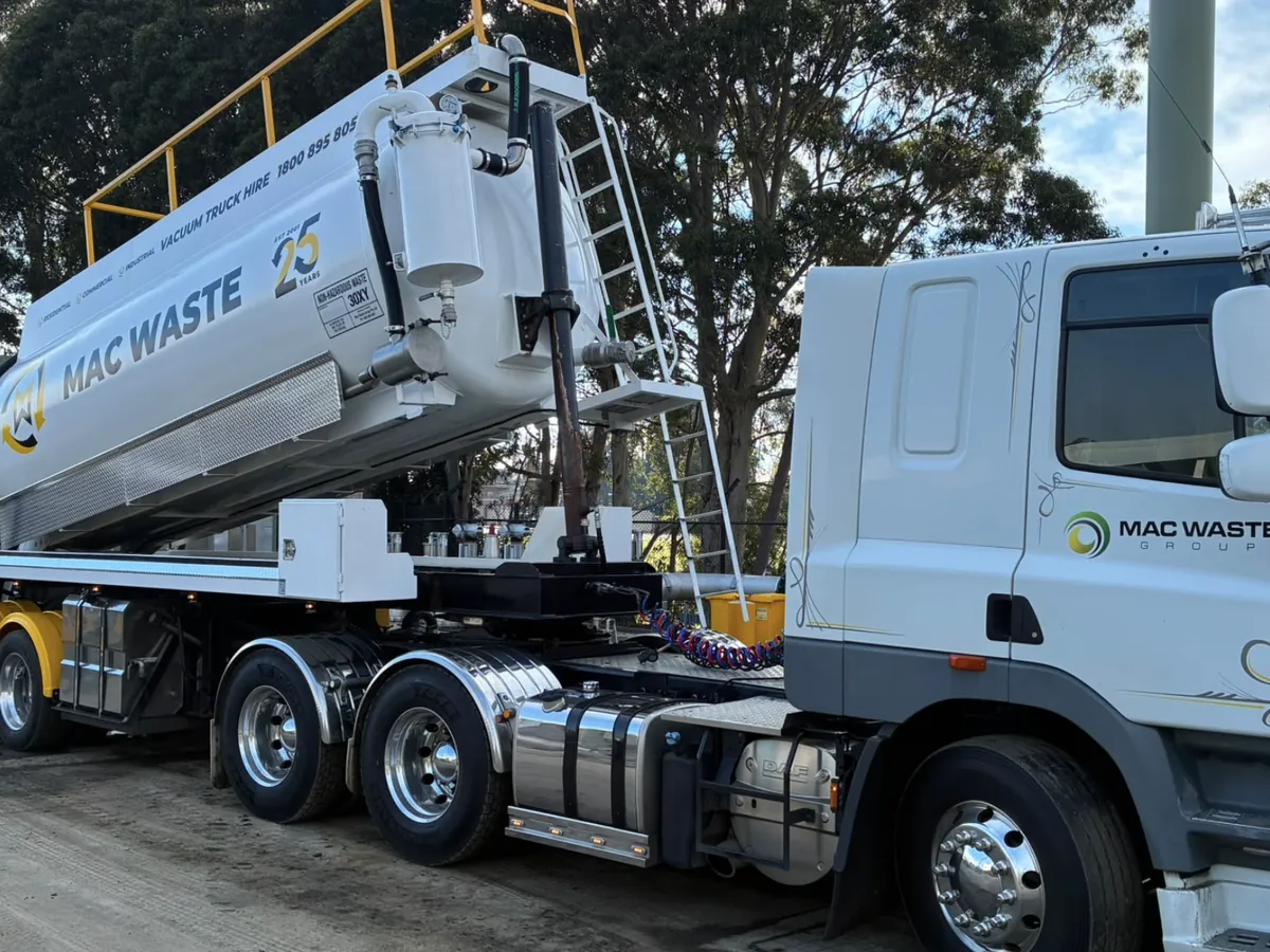 Mac Waste vacuum tanker and prime mover with the tank raised at the depot