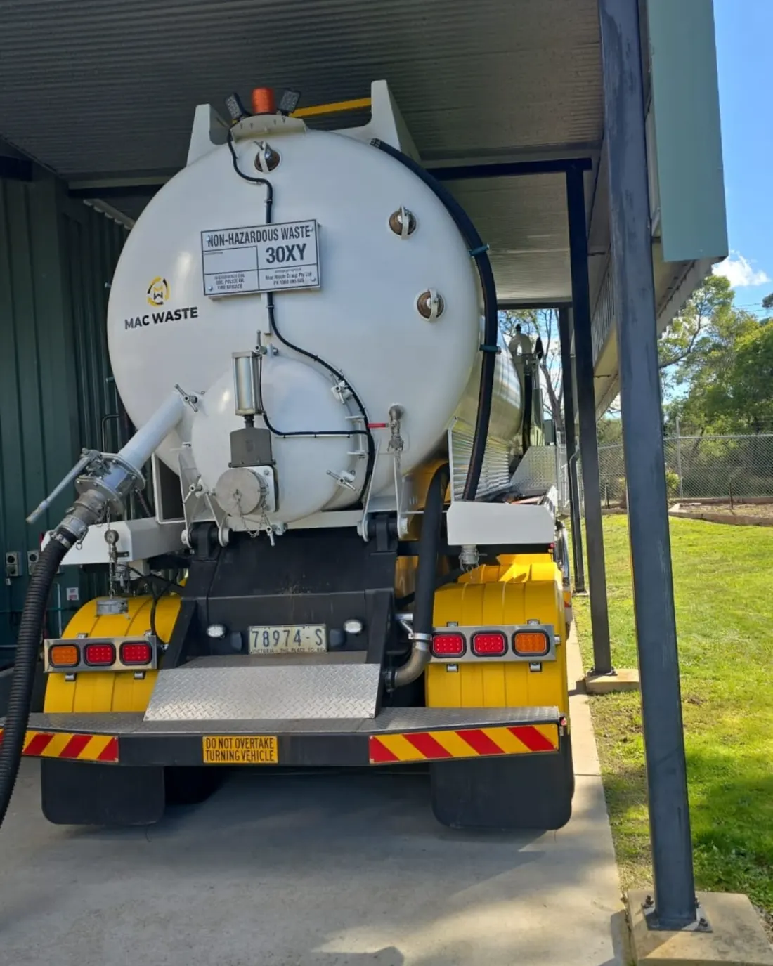 Rear of a Mac Waste vacuum tanker showing the suction gear